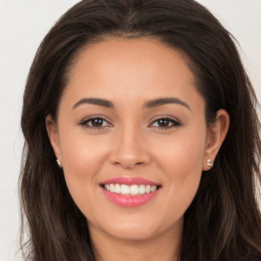 Joyful white young-adult female with long  brown hair and brown eyes