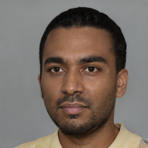 Neutral black young-adult male with short  black hair and brown eyes