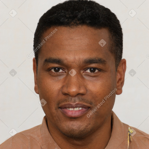 Joyful black young-adult male with short  black hair and brown eyes