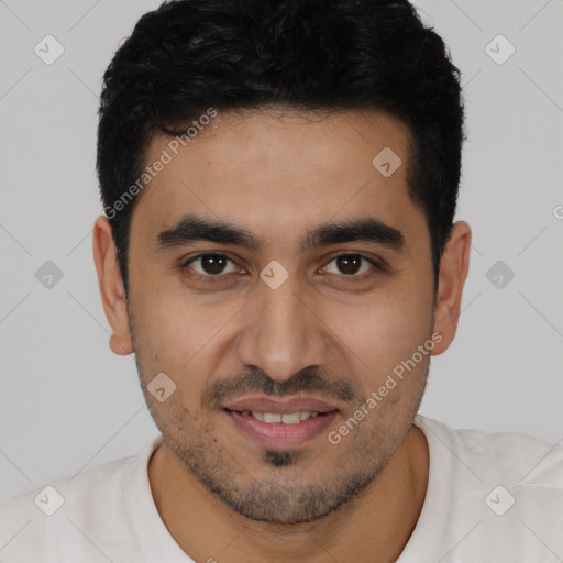 Joyful latino young-adult male with short  black hair and brown eyes