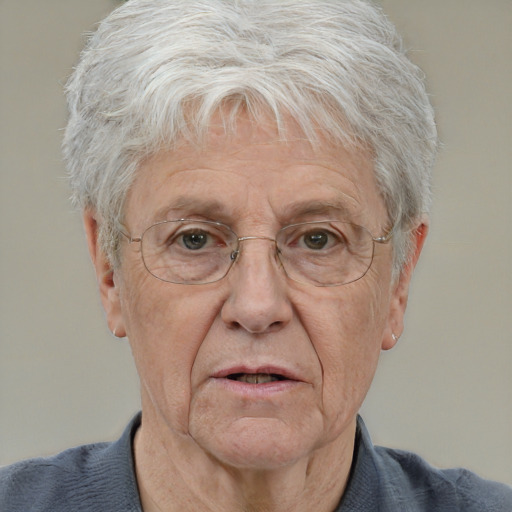 Neutral white middle-aged male with short  gray hair and blue eyes