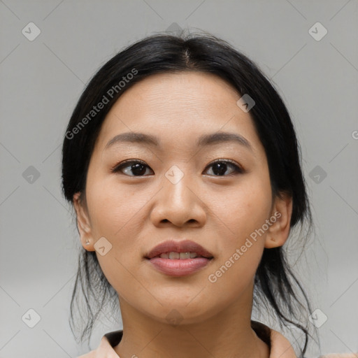 Joyful asian young-adult female with medium  black hair and brown eyes