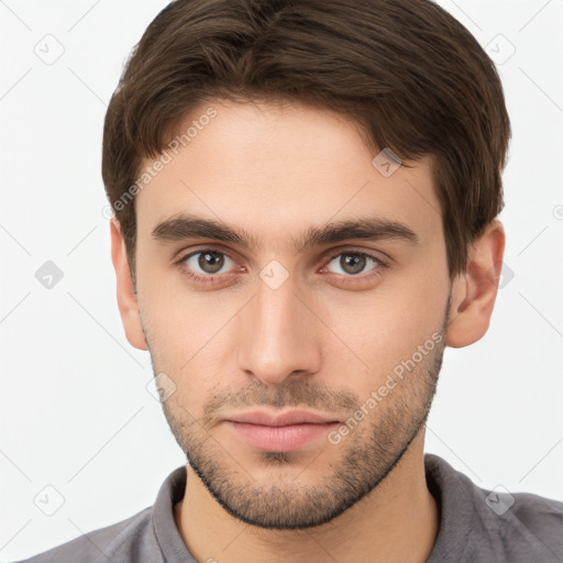 Neutral white young-adult male with short  brown hair and brown eyes