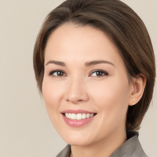 Joyful white young-adult female with medium  brown hair and brown eyes