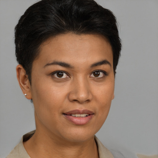 Joyful latino young-adult female with short  brown hair and brown eyes