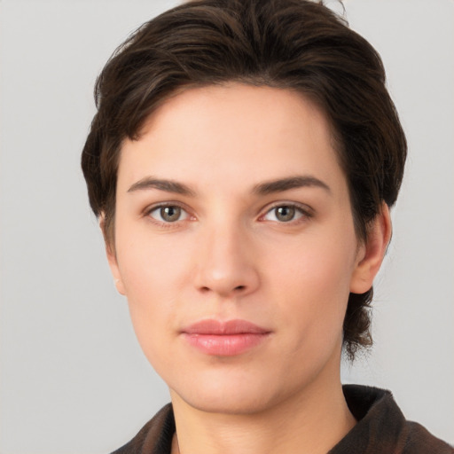 Neutral white young-adult female with short  brown hair and brown eyes