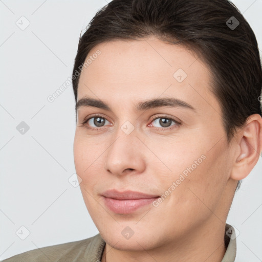 Joyful white young-adult female with short  brown hair and brown eyes