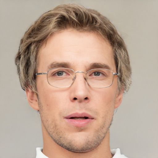 Joyful white adult male with short  brown hair and grey eyes