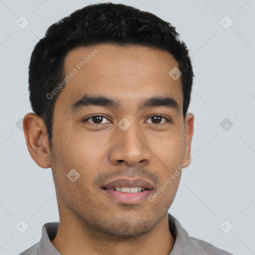 Joyful latino young-adult male with short  black hair and brown eyes