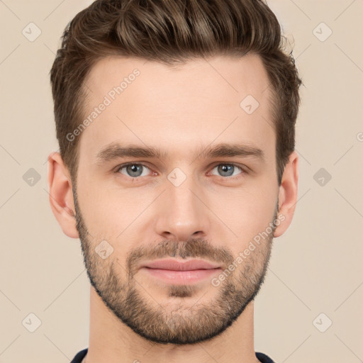 Joyful white young-adult male with short  brown hair and grey eyes