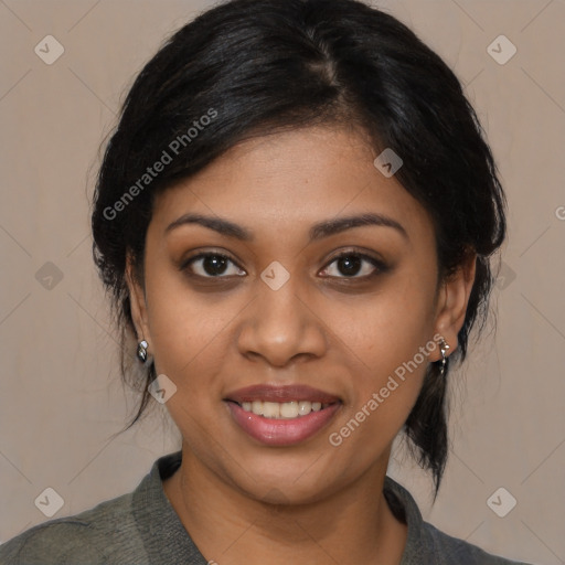 Joyful black young-adult female with medium  brown hair and brown eyes