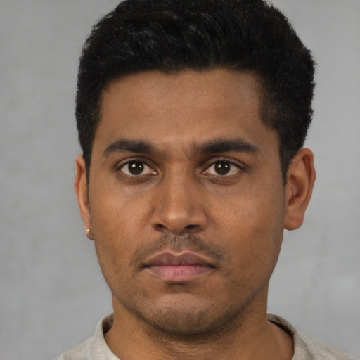 Neutral latino young-adult male with short  black hair and brown eyes