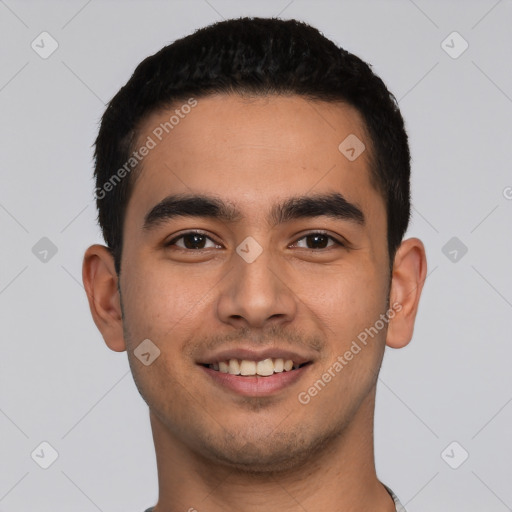 Joyful latino young-adult male with short  black hair and brown eyes