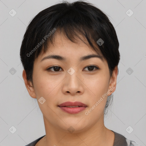 Joyful asian young-adult female with short  brown hair and brown eyes