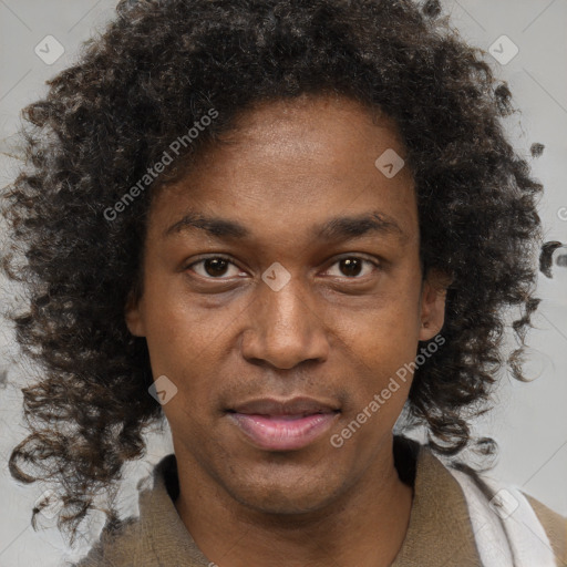 Joyful black young-adult male with short  brown hair and brown eyes