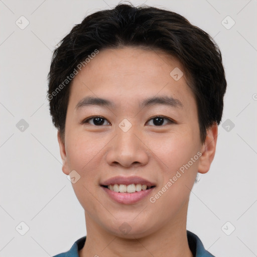 Joyful asian young-adult male with short  brown hair and brown eyes