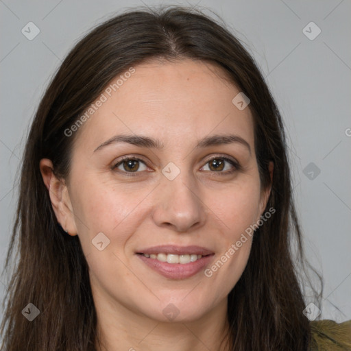 Joyful white young-adult female with long  brown hair and brown eyes