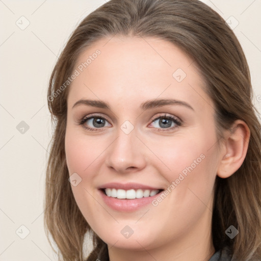 Joyful white young-adult female with long  brown hair and blue eyes