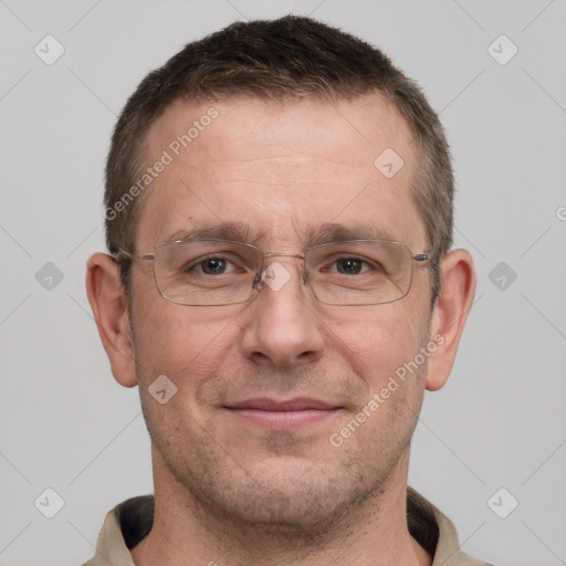 Joyful white adult male with short  brown hair and grey eyes