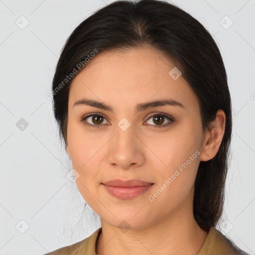 Joyful latino young-adult female with medium  brown hair and brown eyes