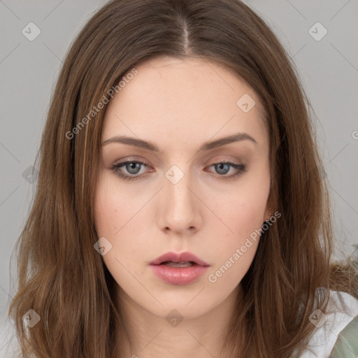 Neutral white young-adult female with long  brown hair and brown eyes