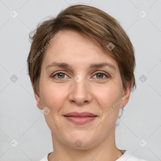 Joyful white adult female with short  brown hair and grey eyes