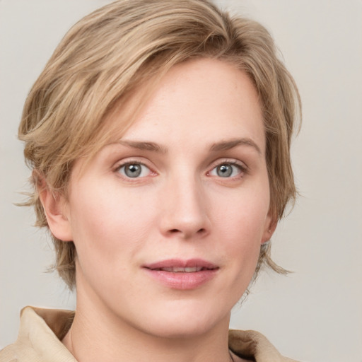 Joyful white young-adult female with medium  brown hair and blue eyes