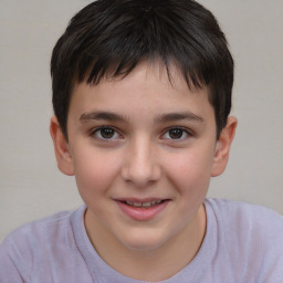 Joyful white child male with short  brown hair and brown eyes