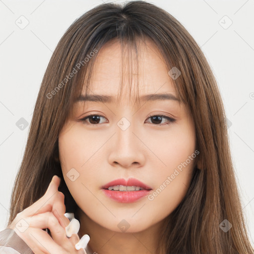 Neutral white young-adult female with long  brown hair and brown eyes