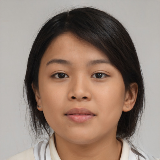 Neutral asian young-adult female with medium  brown hair and brown eyes