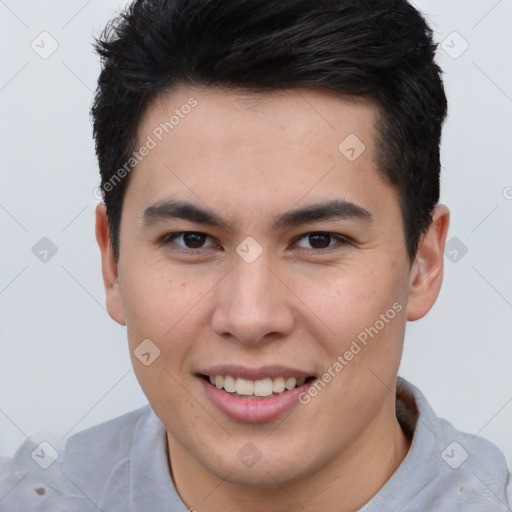 Joyful asian young-adult male with short  brown hair and brown eyes