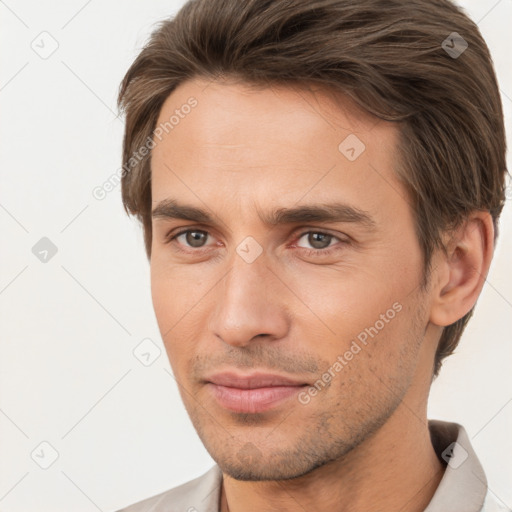 Joyful white young-adult male with short  brown hair and brown eyes