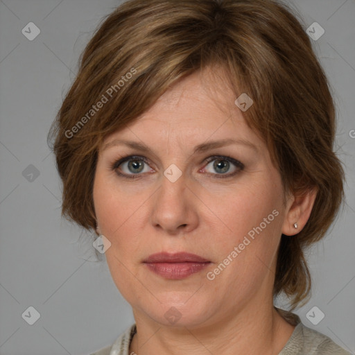 Joyful white adult female with medium  brown hair and grey eyes