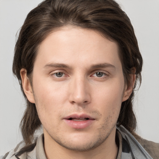 Neutral white young-adult male with medium  brown hair and brown eyes