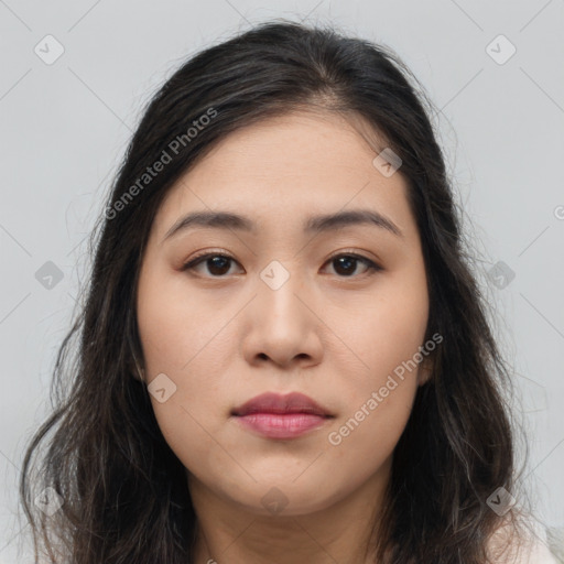 Joyful asian young-adult female with long  brown hair and brown eyes