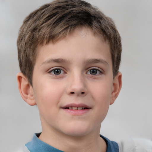 Joyful white child male with short  brown hair and brown eyes