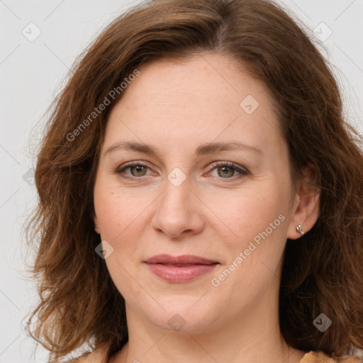 Joyful white young-adult female with long  brown hair and green eyes