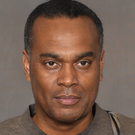 Neutral black adult male with short  black hair and brown eyes
