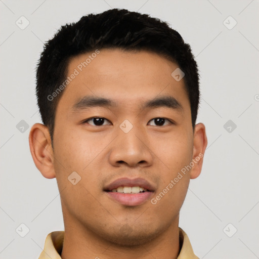 Joyful asian young-adult male with short  black hair and brown eyes