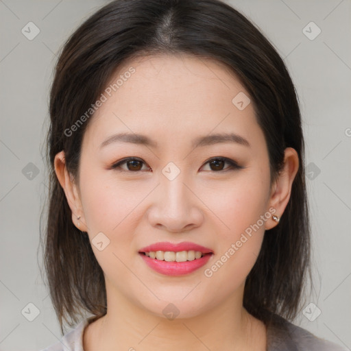 Joyful asian young-adult female with medium  brown hair and brown eyes