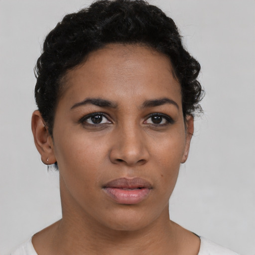 Neutral latino young-adult female with short  brown hair and brown eyes