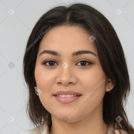 Joyful latino young-adult female with medium  brown hair and brown eyes