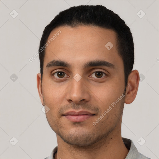 Neutral latino young-adult male with short  black hair and brown eyes