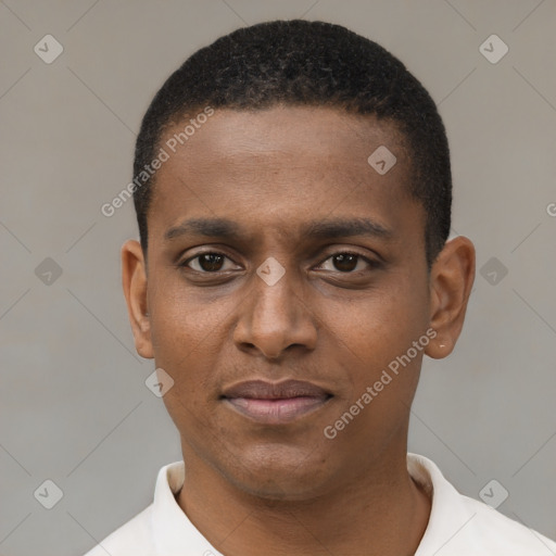 Joyful black young-adult male with short  black hair and brown eyes