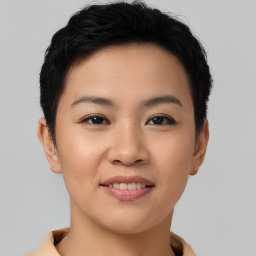 Joyful asian young-adult female with short  brown hair and brown eyes