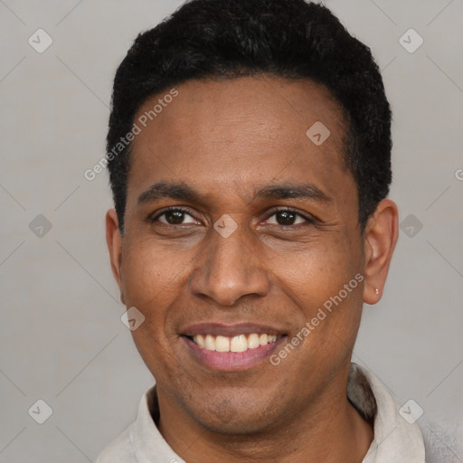 Joyful latino young-adult male with short  black hair and brown eyes