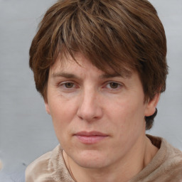 Joyful white adult female with short  brown hair and brown eyes