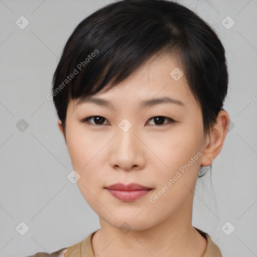 Joyful asian young-adult female with short  brown hair and brown eyes