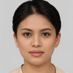 Joyful asian young-adult female with short  black hair and brown eyes