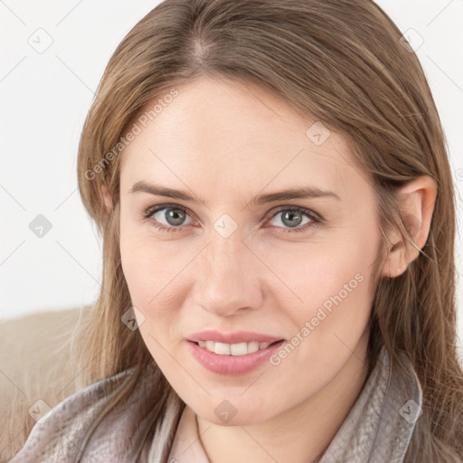 Joyful white young-adult female with long  brown hair and grey eyes